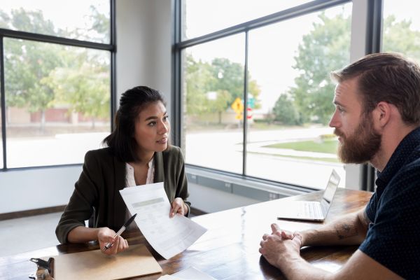 Loan officer reviews customer's loan application